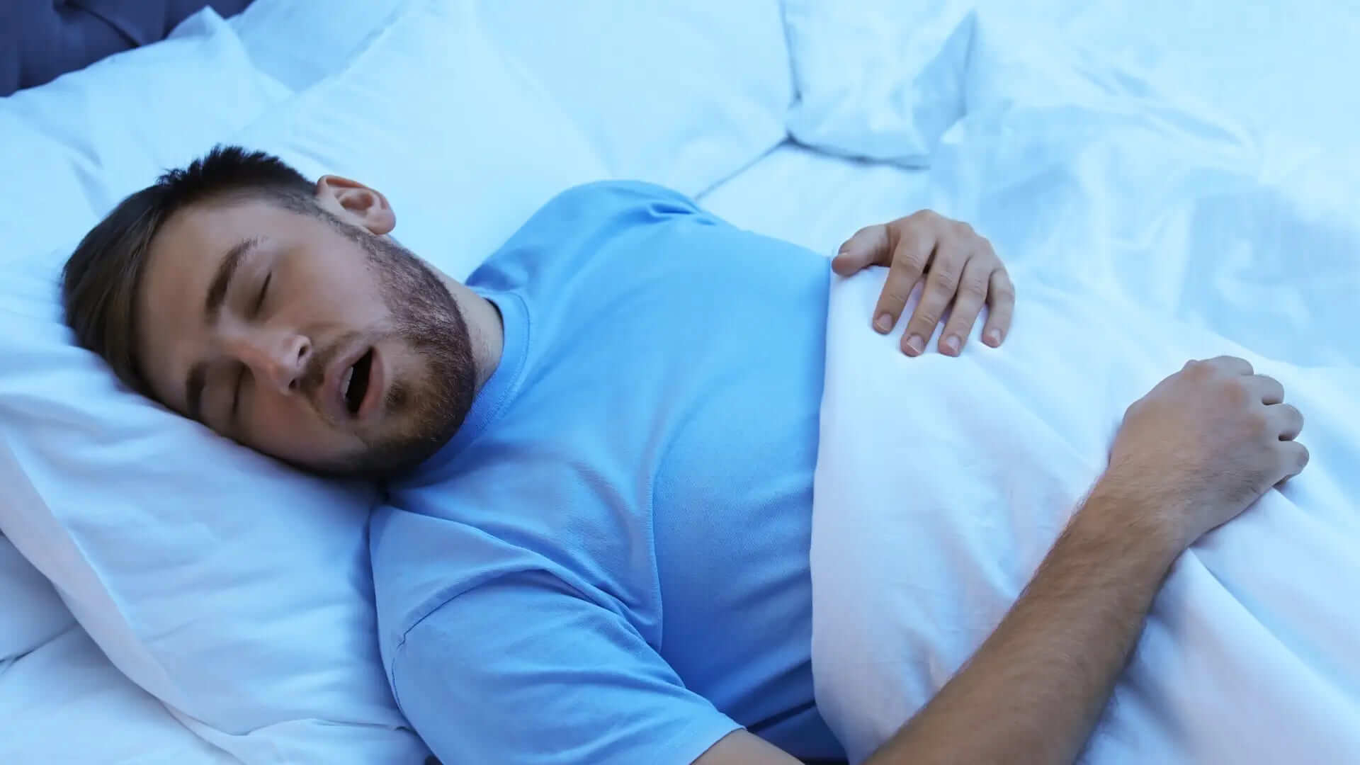 man sleeping with sleep apnea