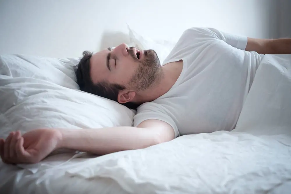 man sleeing with sleep apnea